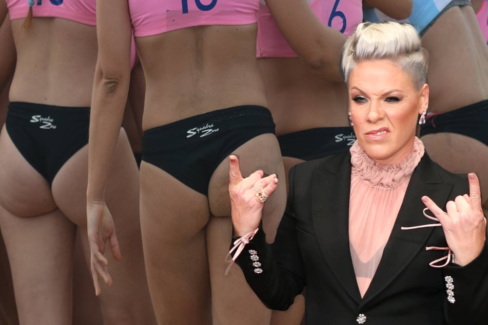 Pink makes big offering in support of women handball players' sexism protest