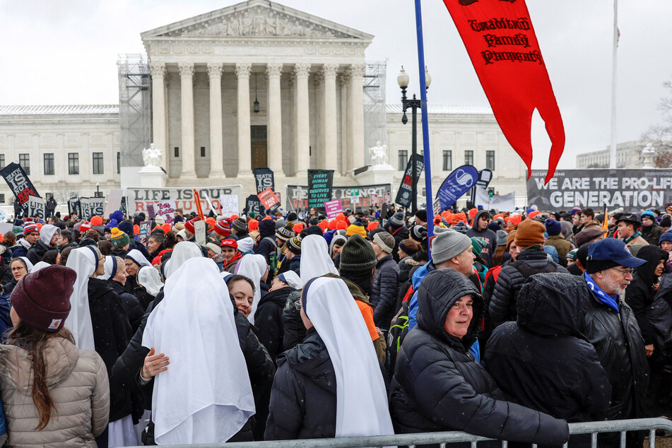 Thousands of anti-abortion protesters marched past the US Supreme Court on Friday, demanding more restrictions on reproductive health.