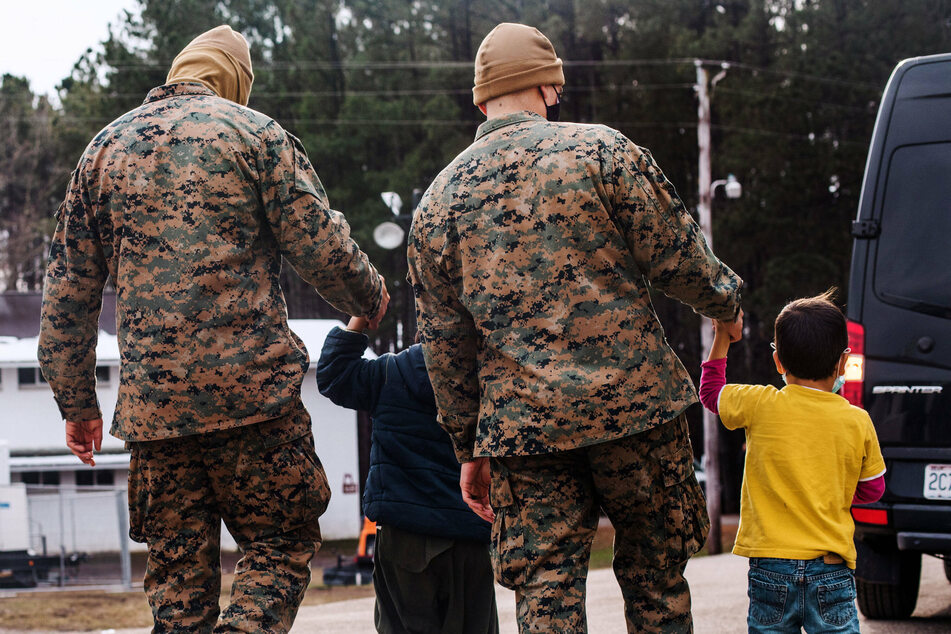 Marines with Afghan children at Fort Pickett, Virginia.