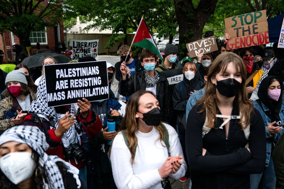 Activists and students protest near an encampment at University Yard at George Washington University on April 27.