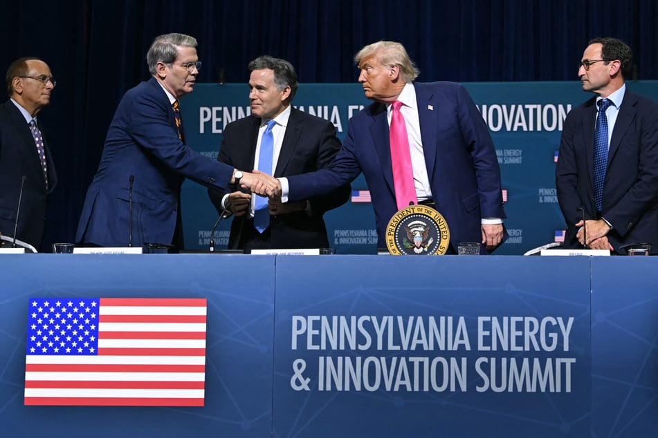 CEO of BlackRock Larry Fink (L), US Senator Dave McCormick (R-PA) (C) and CEO of Blackstone Group Jon Gray (R) look on as US President Donald Trump (2R) shakes hands with US Secretary of Treasury Scott Bessent at the end of the Pennsylvania Energy and Innovation Summit on the campus of Carnegie Mellon University in Pittsburgh, Pennsylvania on Tuesday.