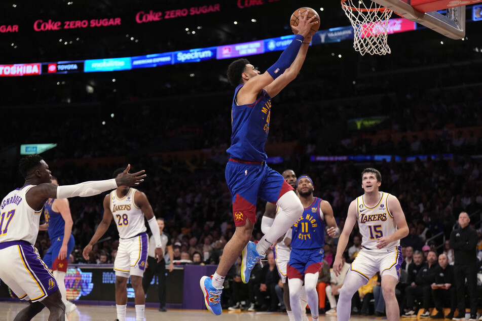 Jamal Murray (c.) scored 37 points as the Denver Nuggets routed the Los Angeles Lakers 119-108 to move within one win of their first NBA finals.