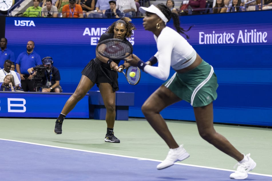 Serena (l.) and Venus Williams play against the Czech Republic's Lucie Hradecka and Linda Noskova during their 2022 US Open Tennis tournament women's doubles first-round match in New York on September 1, 2022.