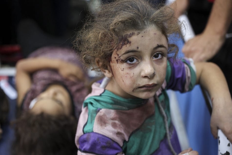 Children injured during an Israeli attack in the Jabalia refugee camp in the central Gaza Strip await treatment at Al-Ahli Arab hospital on October 21, 2024.