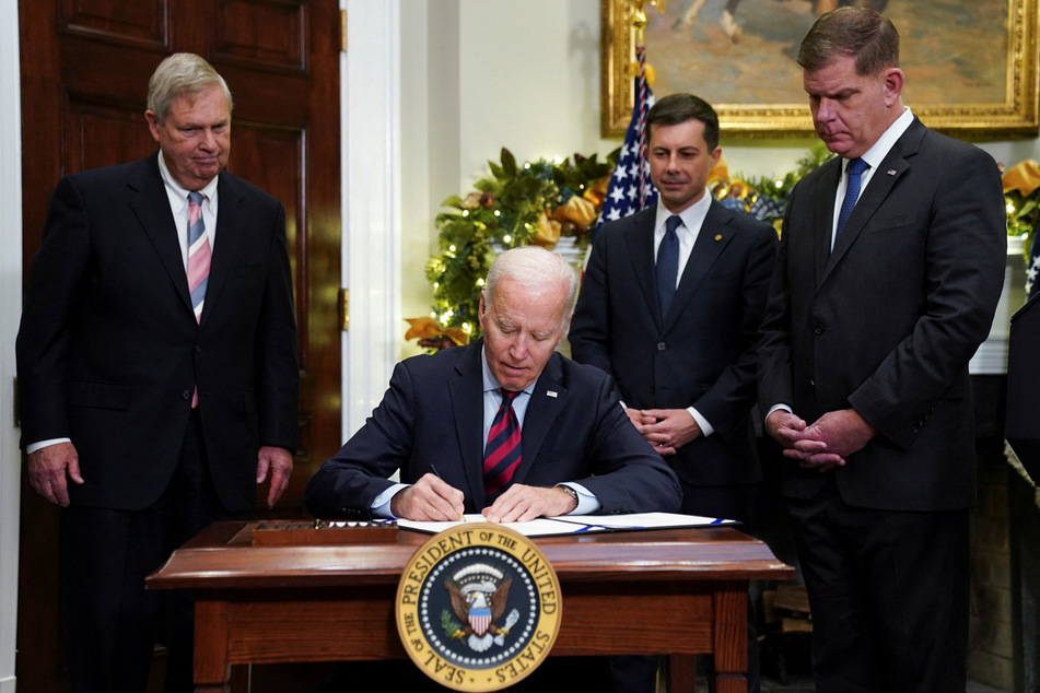 President Joe Biden signs the railroad bill into law.