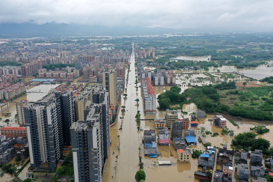 Chinese cities such as Guangzhou and Shenzhen have been hit by major flooding.