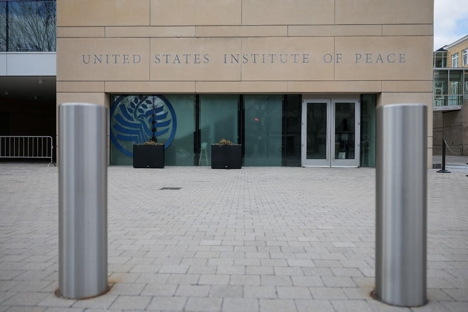 A sign for the US Institute of Peace is pictured on its' building headquarters in Washington DC.