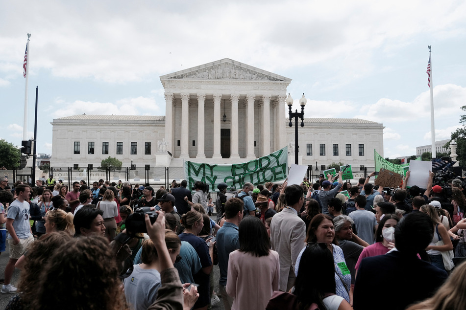 Demonstrators gathered outside the United States Supreme Court on Friday as the court ruled in the Dobbs v Women's Health Organization abortion case, overturning the landmark Roe v Wade abortion access decision in Washington.