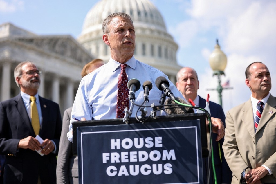 Perry, joined by members of the House Freedom Caucus, speaks at a news conference outside the Capitol Building in August 2021.