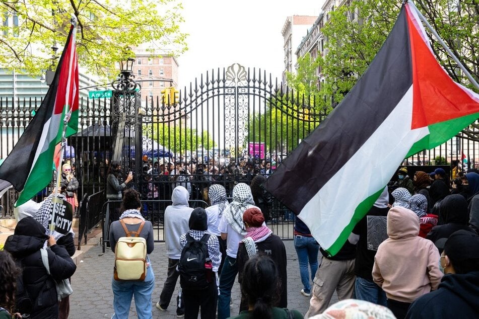 Student protesters gather in solidarity with the Palestinian people near an entrance to Columbia University in New York City.