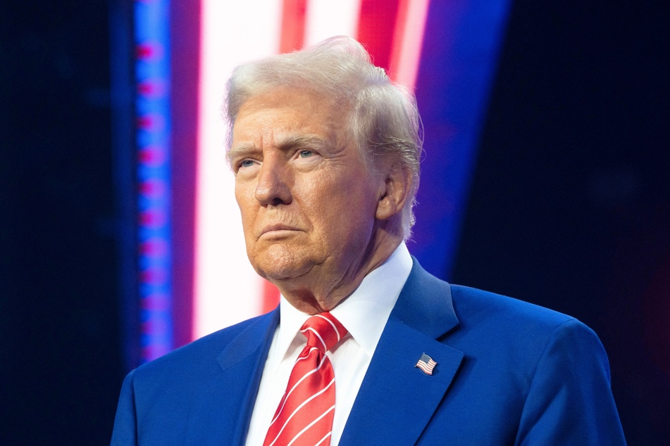 Donald Trump on stage during Turning Point USA's AmericaFest at the Phoenix Convention Center on December 22, 2024 in Phoenix, Arizona.