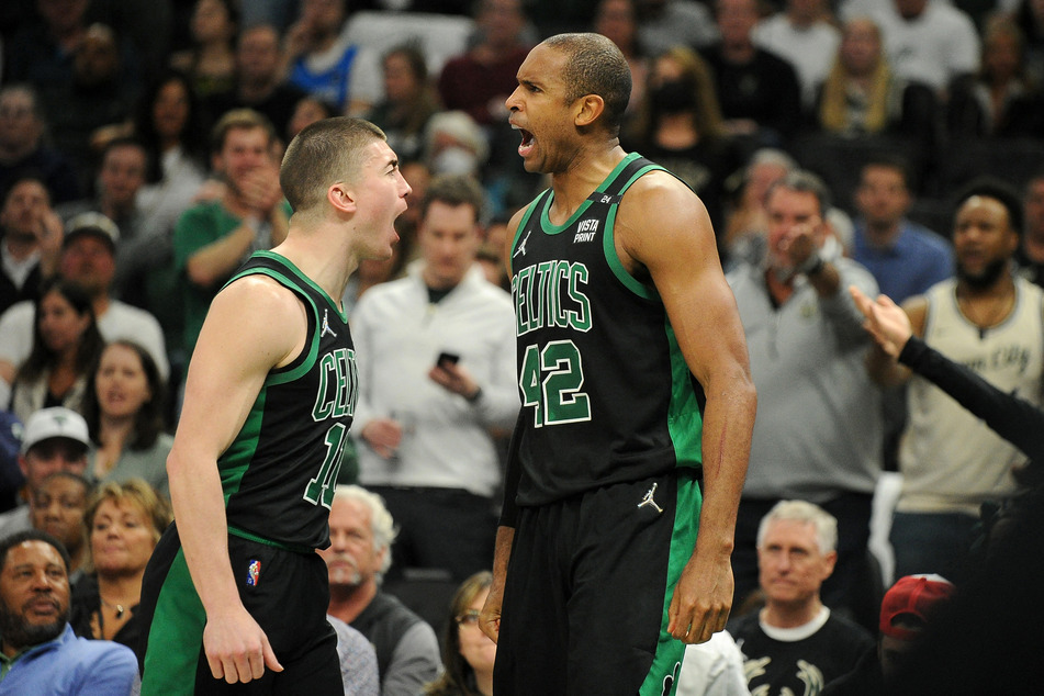 The Celtics' Al Horford (r.) scored 30 points while also securing the interior defense against the Bucks.