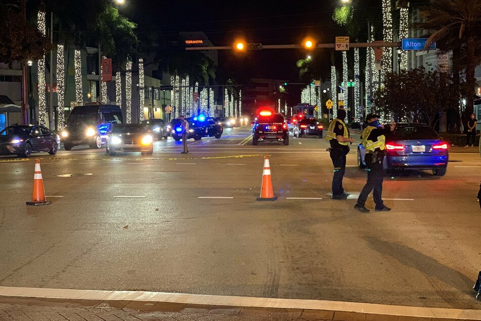 Police patrol the streets of South Beach after a state of emergency is declared.