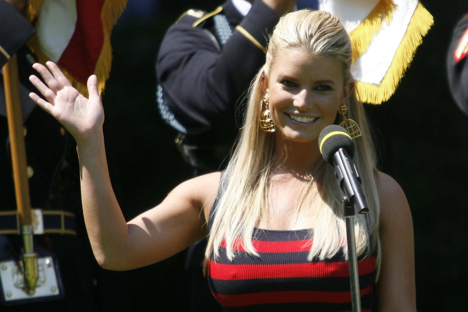 Jessica Simpson (40) singing the national anthem at the AT&amp;T golf tournament in 2009.