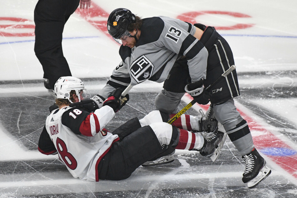 Los Angeles Kings Center Gabriel Vilardi (r.) and Arizona Coyotes Center Christian Dvorak get tangled up after the opening face-off in the Kings' 4-0 win.