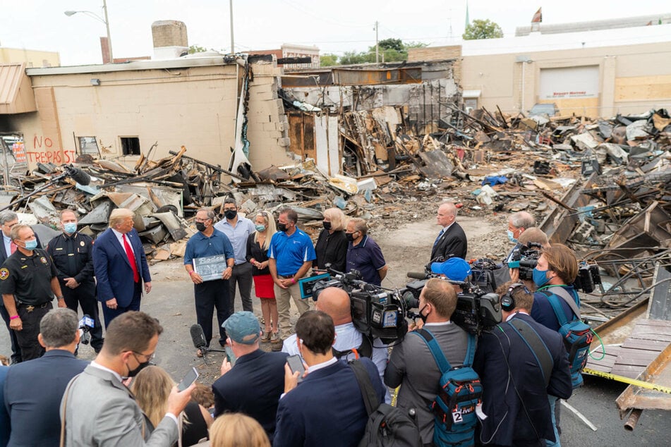 Donald Trump surveying damage from the protests that followed the shooting of 29-year-old African-American Jacob Blake.