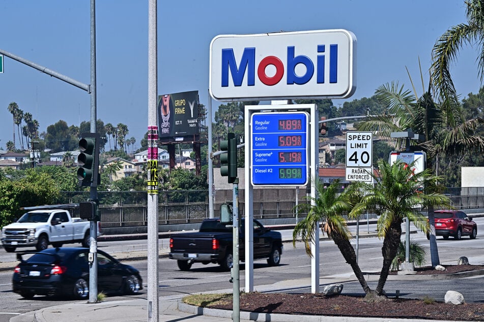 Vehicles pass an ExxonMobil gas station on September 23, 2024 in Rosemead, California.