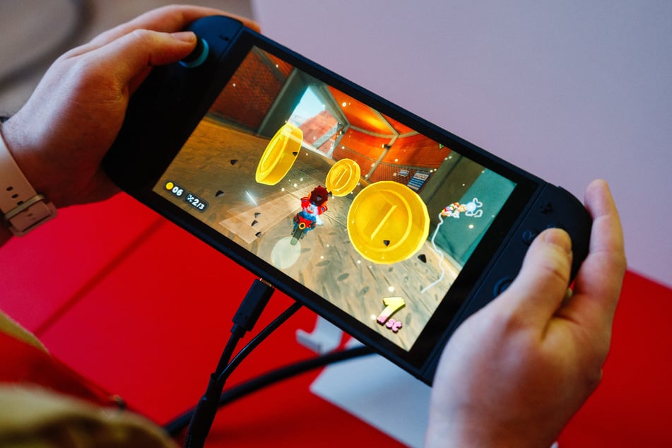 A guest plays Mario Kart World on the new Nintendo Switch 2 gaming console from Japanese video game company Nintendo during the worldwide presentation at the Grand Palais in Paris on April 2, 2025.