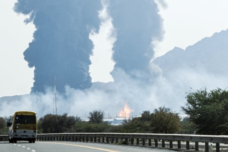 Smoke and flames rise from an energy installation after an apparent strike in the Gulf emirate of Fujairah on March 14, 2026.