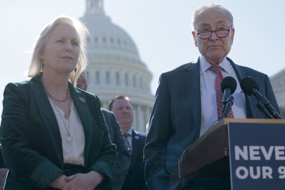 Chuck Schumer (r.) joined with first responders and 9/11 victims outside the Capitol building to rally against cuts to the WTCHP.