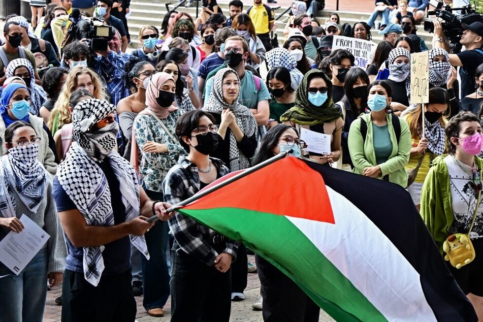 Students wave a Palestinian flag and call for an end to Israel's siege of Gaza on the campus of the University of California, Los Angeles.