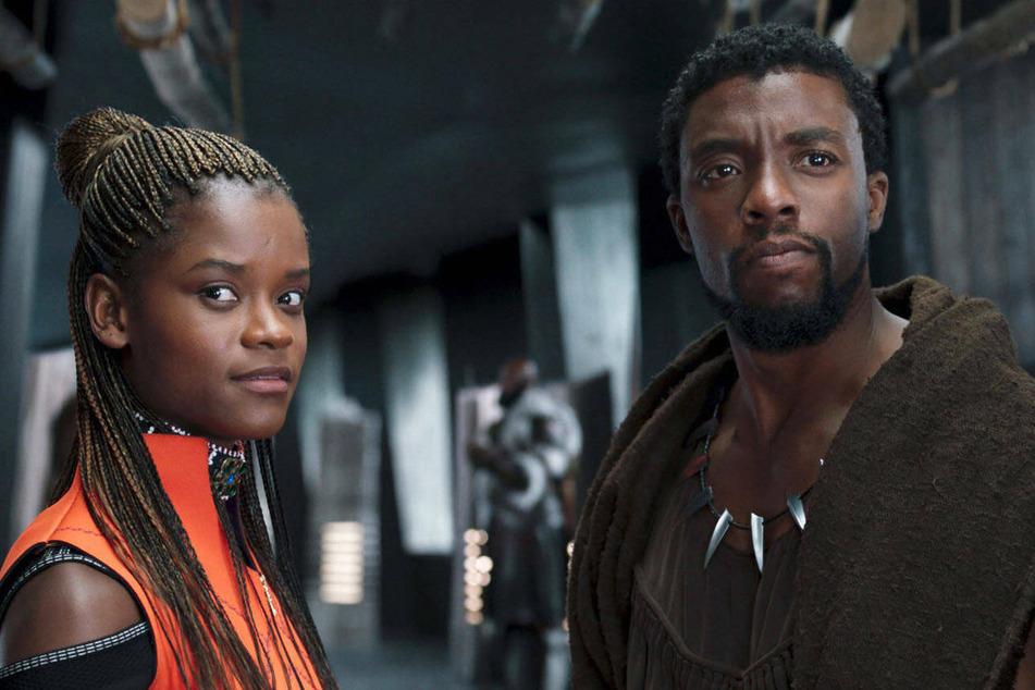 On Monday, the hashtag #RecastTChalla began trending on Twitter after fans suggested that Marvel recast Chadwick Boseman's (r.) role as T'Challa/Black Panther amid Leticia Wright's (l.) alleged anti-vaccination beliefs.