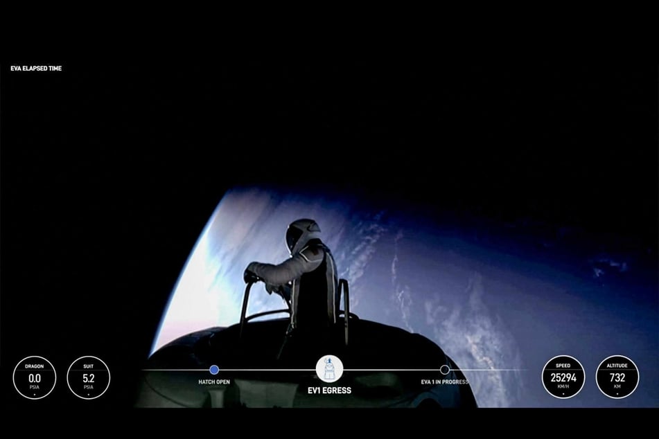 This still image taken from a SpaceX and Polaris broadcast on September 12, 2024, shows US fintech billionaire Jared Isaacman (EV1) peeking out to space from a hatch structure called "Skywalker" during the first private spacewalk performed by the crew of the SpaceX Polaris Dawn mission.