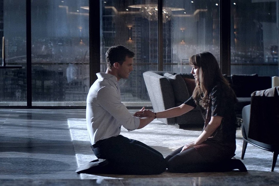 Jamie Dornan (l) and Dakota Johnson tackle the darker side of love as the iconic characters Christian Grey and Ana Steele in the Fifty Shades of Grey franchise.