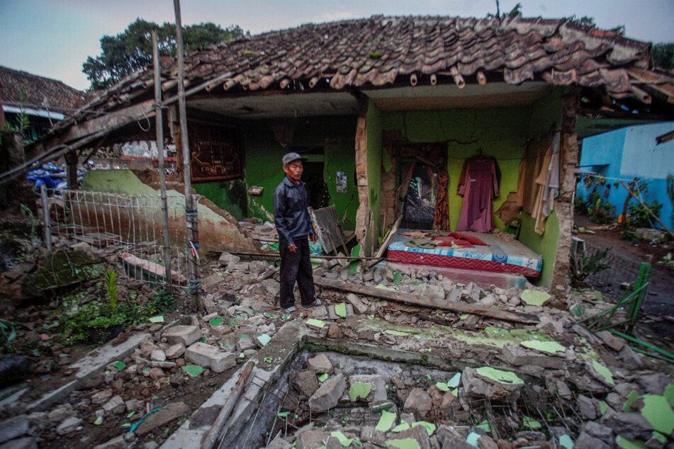 A resident's house is damaged after an earthquake hit in Cianjur, West Java province, Indonesia, on Monday.
