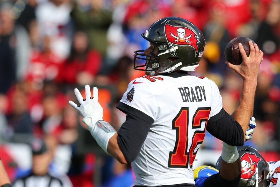 Tom Brady of the Tampa Bay Buccaneers looks to throw the ball against the Los Angeles Rams in the NFC Divisional Playoff game.