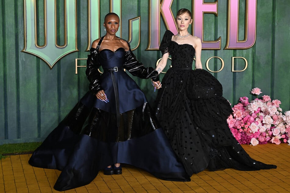 Cynthia Erivo (l.) came Ariana Grande's defense when a fan jumped onto the red carpet for a photo with the singer.