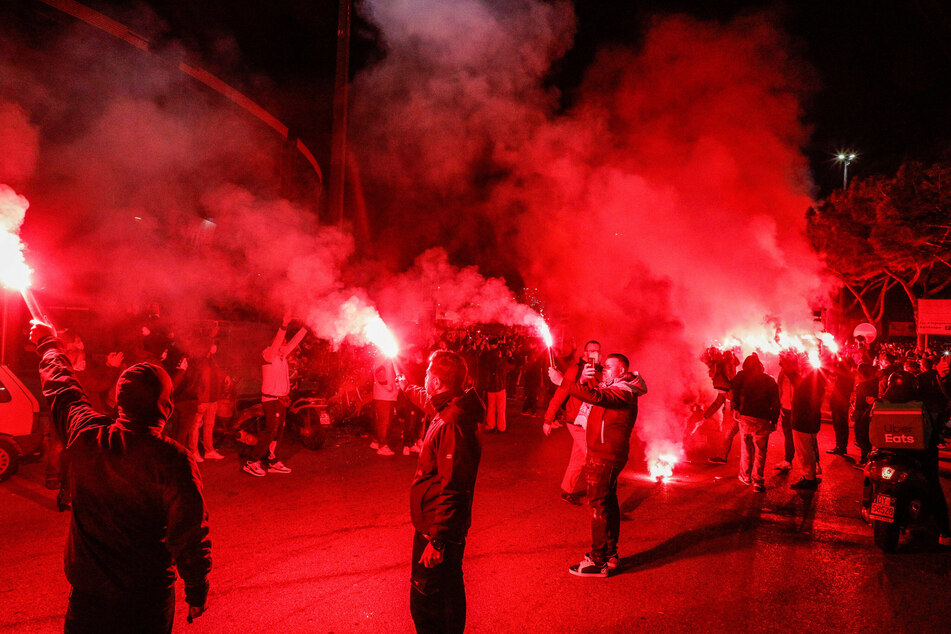 Napoli fans lighting flares in tribute to Diego Maradona, who played seven seasons for the club.