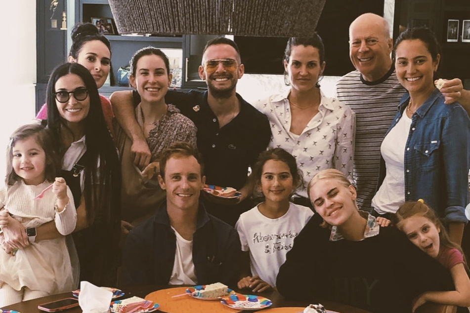 Bruce Willis with his family, including ex-wife Demi Moore (far l.) and wife Emma Heming-Willis.