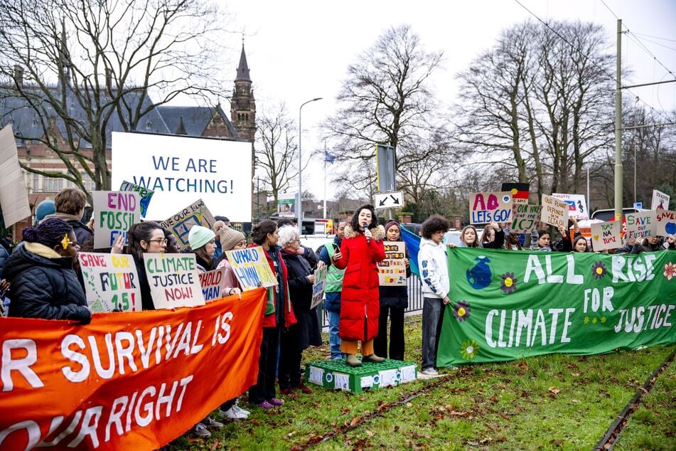 Protesters gathered in front of the ICJ in The Hague, Netherlands to demand action on cliamte change.