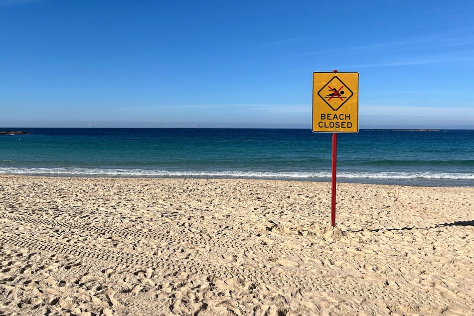 A beach closed sign is displayed at Coogee Beach in Sydney, Australia, on June 13, 2026.