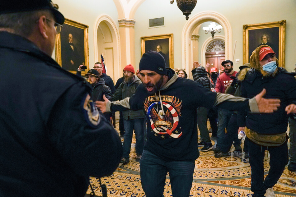 Supporters of the QAnon movement storming the US Capitol.