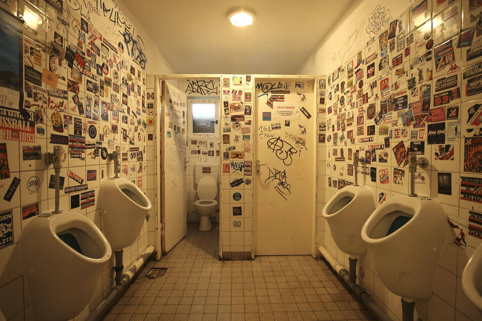There's nothing quite like exploring the walls of a bathroom shamelessly adorned with graffiti and stickers.