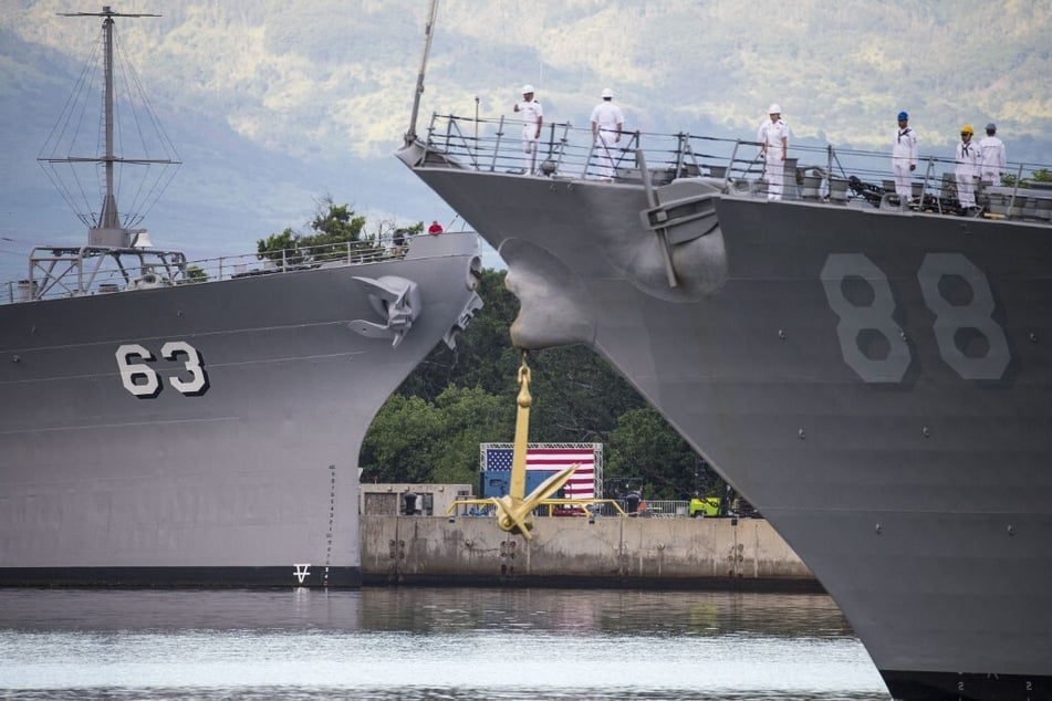 US warships participate in a memorial service to mark the anniversary of the December 7, 1941, attack on Pearl Harbor.