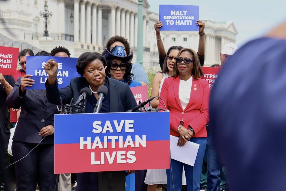 Guerline Jozef of the Haitian Bridge Alliance speaks at a rally and press conference on Capitol Hill demanding renewed protections for Haitian nationals in the US.