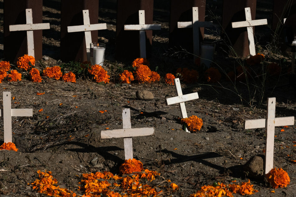 An altar honoring dead migrants on their journey to the United States at the border wall in Tijuana, Mexico, on November 2, 2023.