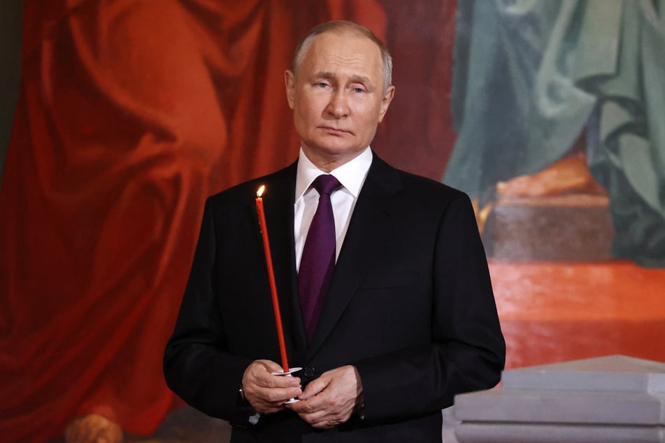 Russian President Vladimir Putin held a candle during an Orthodox Easter service at the Christ the Savior cathedral in Moscow on Sunday.