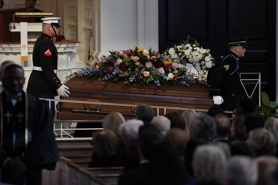 The casket of former US First Lady Rosalynn Carter is carried out following a tribute service at Glenn Memorial Church in Atlanta, Georgia, on Tuesday.