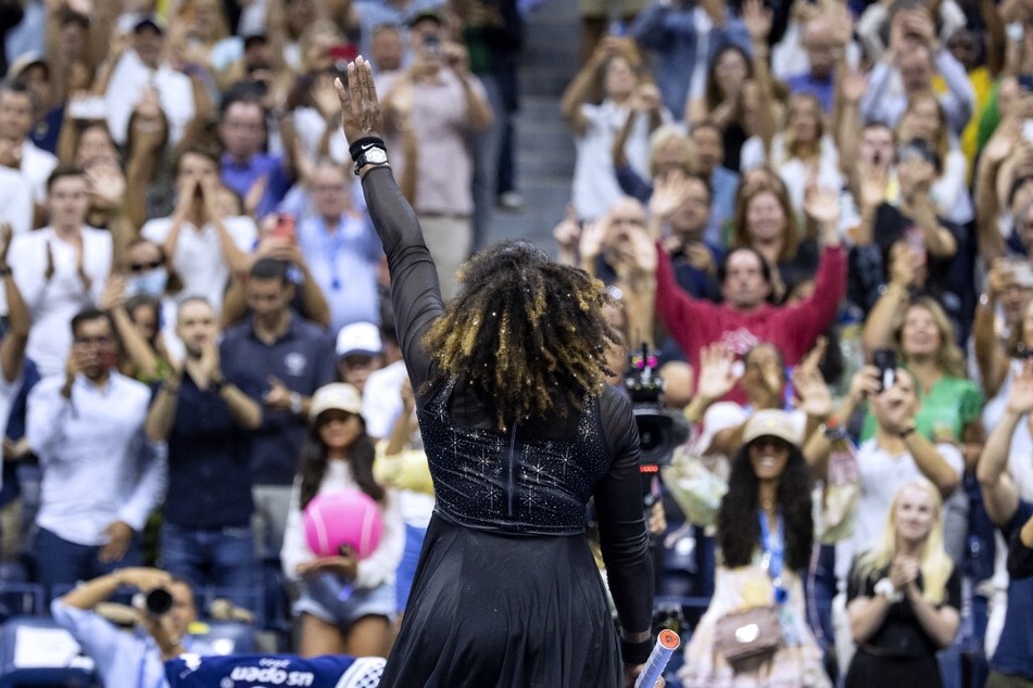 Serena Williams waves to the audience after losing her in final tennis tournament ever at the 2022 US Open Tennis tournament.