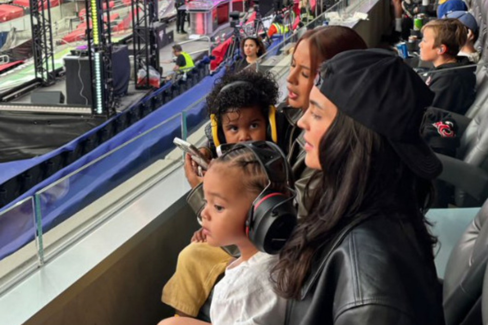 Kylie Jenner (r.) enjoyed the Monster Jam World Finals with her baby boy Aire Webster over the weekend.