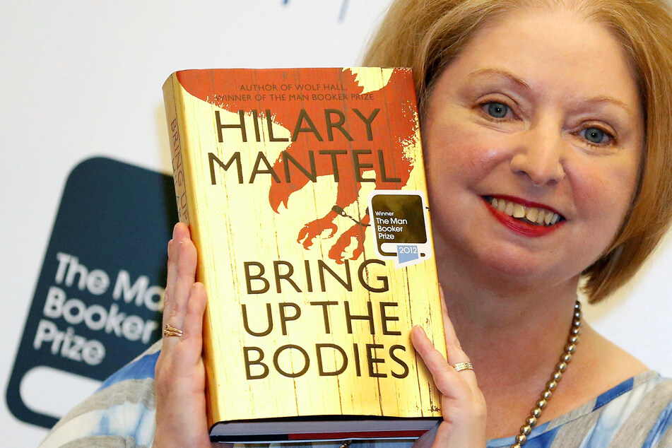 Author Hilary Mantel poses with her book Bring Up the Bodies after winning the 2012 Man Booker Prize.
