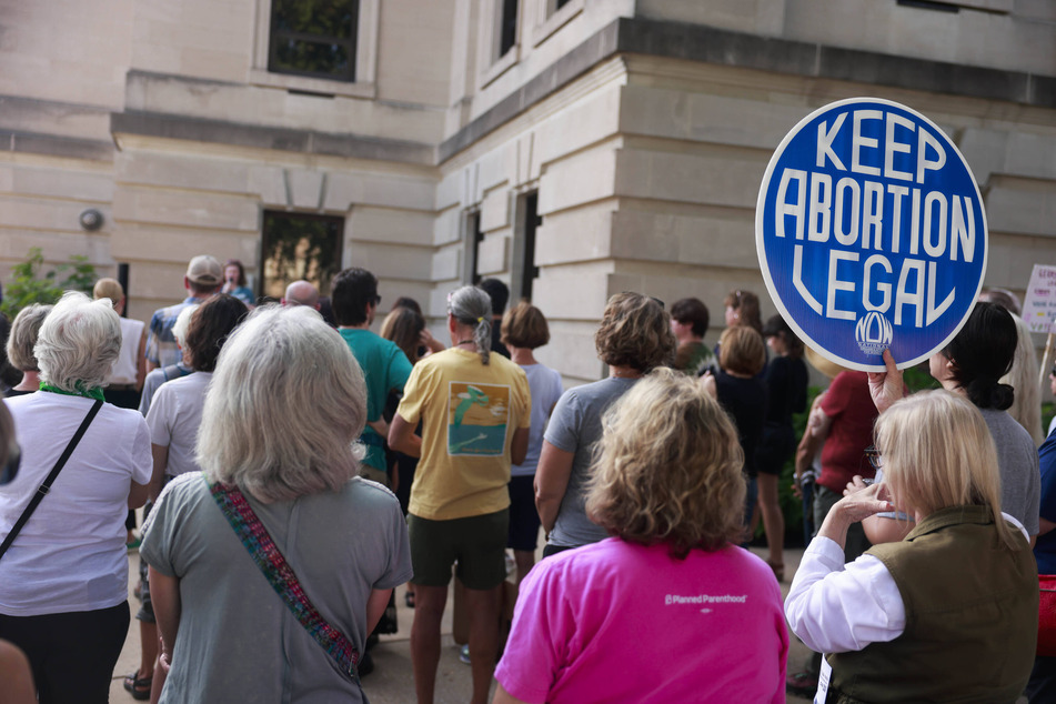 New research says abortions rose in 2023 in states where it's protected. Abortion care advocates outside Monroe County Courthouse in Indiana during a series of vigils before Indiana's near total abortion ban begins.