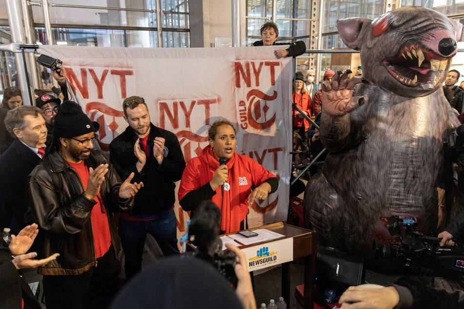 Susan DeCarava, president of the NewsGuild of New York, speaks during a rally to support a union walkout at the New York Times building in Manhattan, New York.