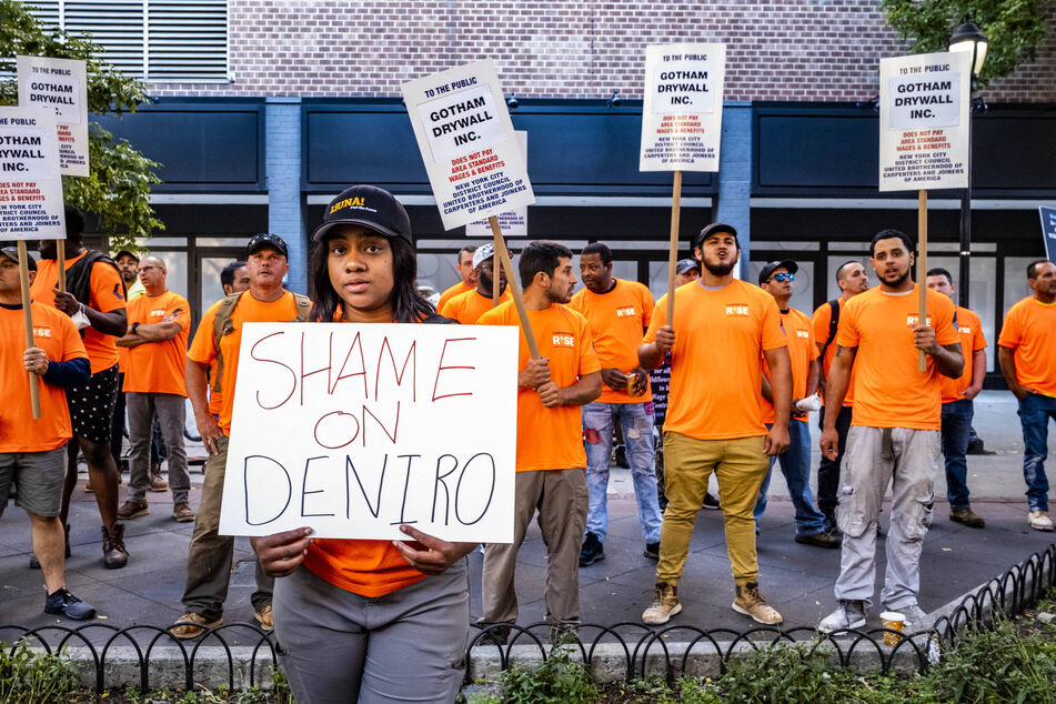 Workers from Local 79 Construction &amp; General Building Laborers Union picket across from Robert De Niro's Tribeca Film Center in June.