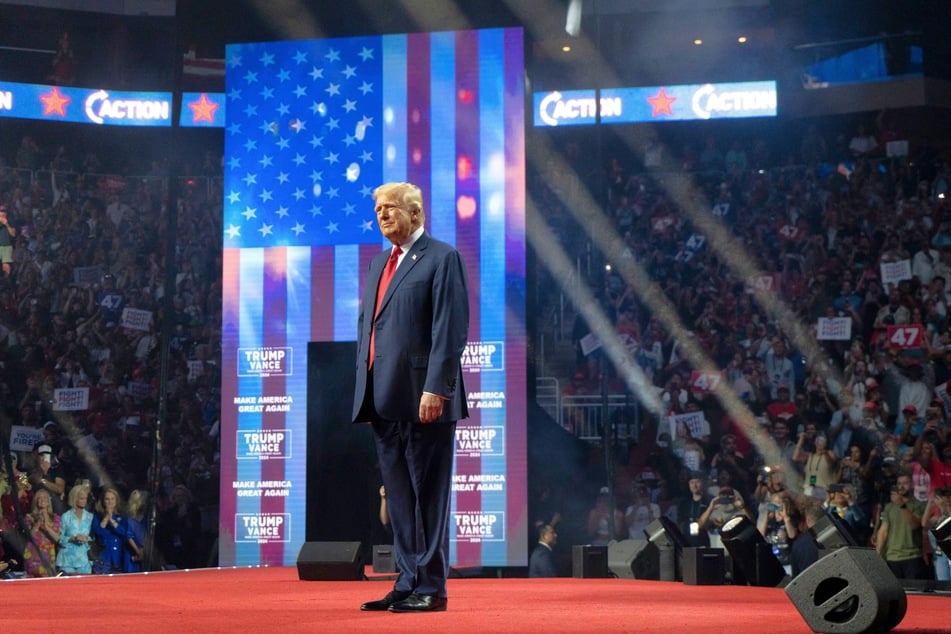 Republican presidential nominee Donald Trump taking the stage at the Desert Diamond Arena in Glendale, Arizona on August 23, 2024.