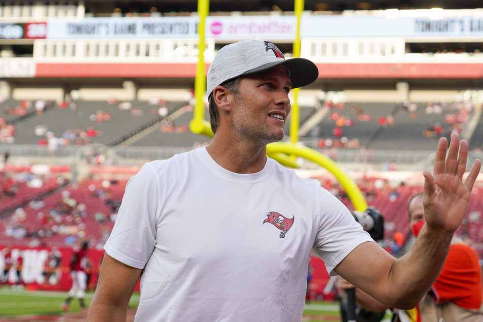 Tom Brady waving to fans before a preseason game against the Tennessee Titans at Raymond James Stadium in Tampa.